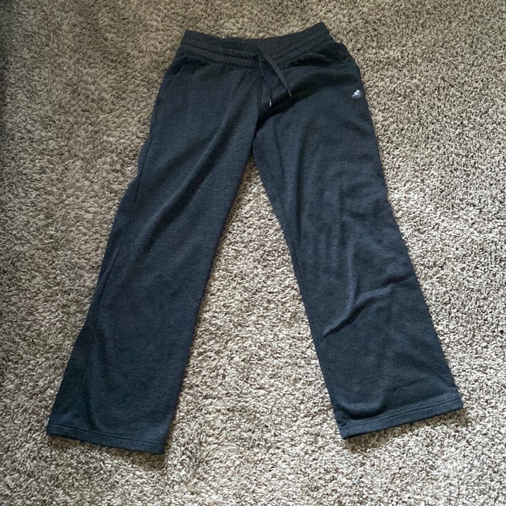 Dark gray fleece Adidas sweat pants.